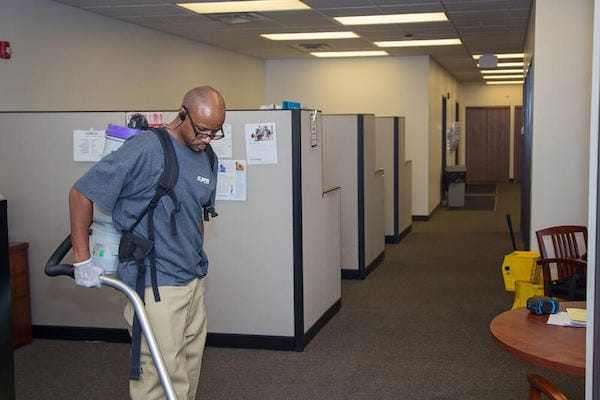 Man cleaning an office